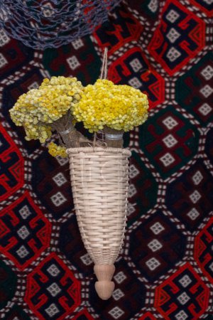 Bunch Helichrysum luteoalbum flower over a carpet