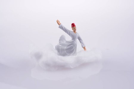 Sufi Dervi sur un nuage sur fond blanc 