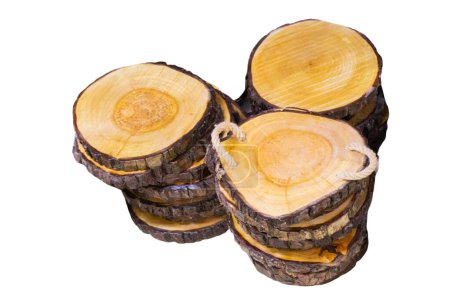 isolated round piece of wood in cross section with a pattern of wood ring texture and cracks.