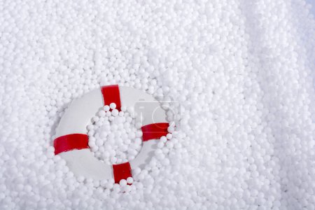 Photo for Lifesaver on little  white polystyrene foam balls - Royalty Free Image