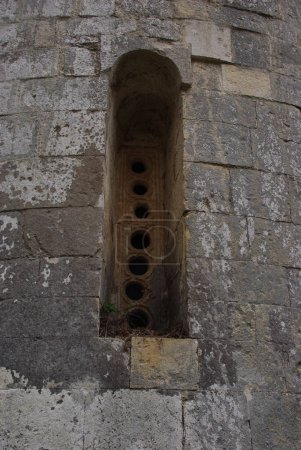 Photo for Capestrano - Abruzzo - Abbey of San Pietro ad Oratorium - Small window of the external apses - Royalty Free Image