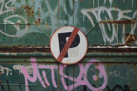 Photo for No parking. Road sign of the circular shape on a background of antique fence. - Royalty Free Image