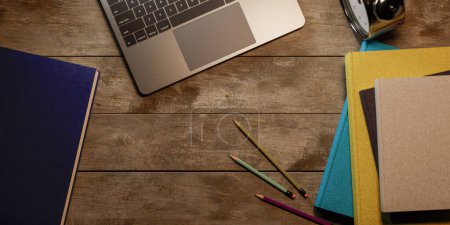 Photo for Top view on the desk with a stack of books with a concept of studying for the school exam, 3d rendering - Royalty Free Image