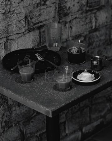 Photo for Table after eating with plate and fork food on concrete table, mexico latin america - Royalty Free Image