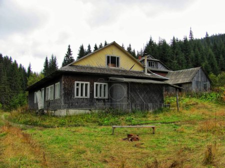Old wooden schoolhouse, forsaken at a village's edge