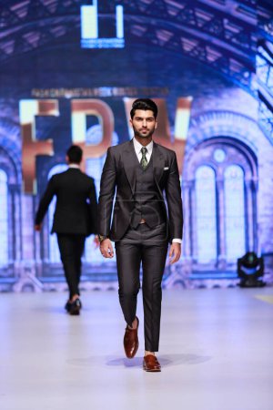 Photo for Models walk on the runway showcasing the designer Emran Rajput's collection at Fashion Pakistan Week Winter Festive 21-22. Fashion week in Karachi 14th October 2021 - Royalty Free Image