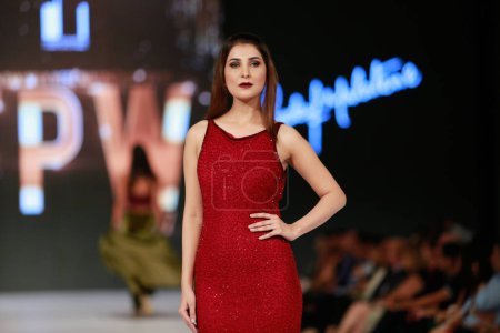 Photo for Model on the runway showcasing the dress collection" at Fashion Pakistan Week Winter Festive 21-22 Day 2. Fashion week in Karachi 15th October 2021 - Royalty Free Image
