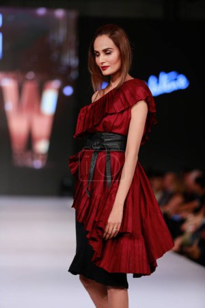 Photo for Model walks on the runway showcasing Sadaf's collection at Fashion Pakistan Week Winter Festive 21-22. Fashion week in Karachi 14th October 2021 - Royalty Free Image