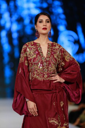 Photo for Model on the runway showcasing the dress collection" at Fashion Pakistan Week Winter Festive 21-22 Day 2. Fashion week in Karachi 15th October 2021 - Royalty Free Image