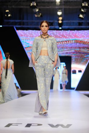 Photo for Models on the runway showcasing the dress collection" at Fashion Pakistan Week Winter Festive 21-22 Day 2. Fashion week in Karachi 15th October 2021 - Royalty Free Image