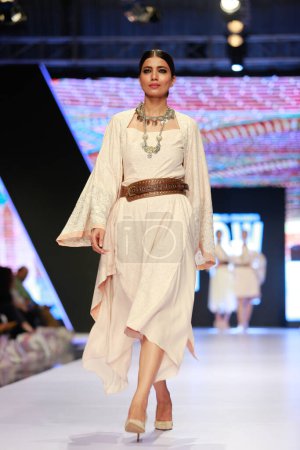 Photo for Models on the runway showcasing the dress collection" at Fashion Pakistan Week Winter Festive 21-22 Day 2. Fashion week in Karachi 15th October 2021 - Royalty Free Image