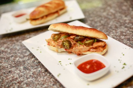 Photo for Saucy Chicken sandwiches with Jalapeo - Royalty Free Image