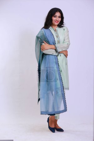 Photo for Beautiful Pakistani Woman in traditional embroidery shalwar kameez dress with dupatta. `Desi Fashion Concept - Royalty Free Image