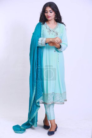 Photo for Beautiful Pakistani Woman in traditional embroidery shalwar kameez dress with dupatta. `Desi Fashion Concep - Royalty Free Image