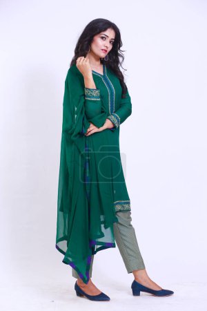 Photo for Beautiful Pakistani Woman in green traditional embroidery shalwar kameez dress with dupatta. Fashion Concept - Royalty Free Image