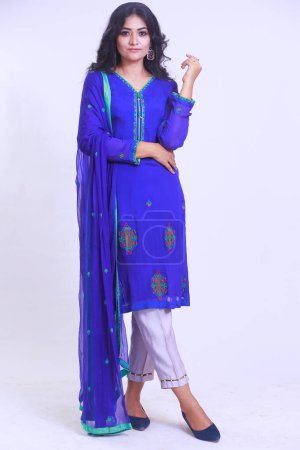 Photo for Beautiful Pakistani Woman in Blue traditional embroidery shalwar kameez dress. Fashion Concept - Royalty Free Image