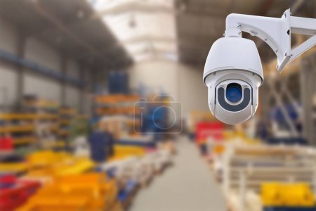 Photo for CCTV Camera or surveillance operating inside industrial factory. Copy space - Royalty Free Image