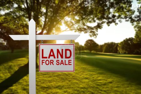 Photo for LAND FOR SALE SIGN on empty meadow - Real estate conceptual image - Royalty Free Image