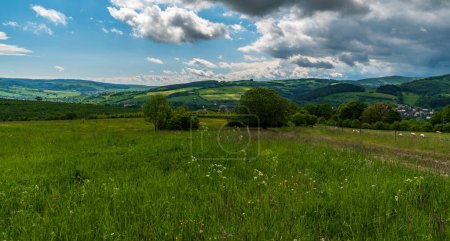 Photo for Beutiful springtime Bile Karpaty mountains withl hills covered by mountain meadows and forest around Brumov - Bylnice village in Czech republic - Royalty Free Image