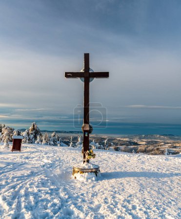 Photo for Cross on Velka Raca hill sumit with hills on the background in winter Kysucke Beskydy ountains on slovakian - polish borders - Royalty Free Image