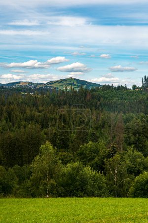 Photo for Ochodzita hill in Beskid Slaski mountains from meadow above Jaworzynkja village in Poland - Royalty Free Image