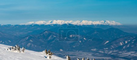 Tatra mountains and nearer lower Velka Fatra mountains from Martinske hole in winter Mala Fatra mountains in Slovakia