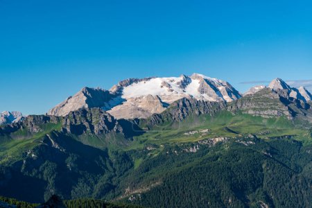 Marmolada mountain ridge with highest Punta Penia mountain peak in the Dolomites from hiking trail bellow Setssaa mountain peak in the Dolomites