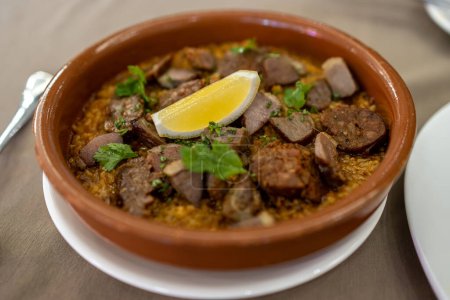 Photo for Popular Portugal dish Portuguese octopus rice - Royalty Free Image