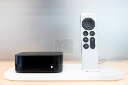 Photo for Product shot of the Apple TV 4k 2022 with WiFi and Ethernet, 128Gb RAM, and with Siri Remote, on store background. - Royalty Free Image