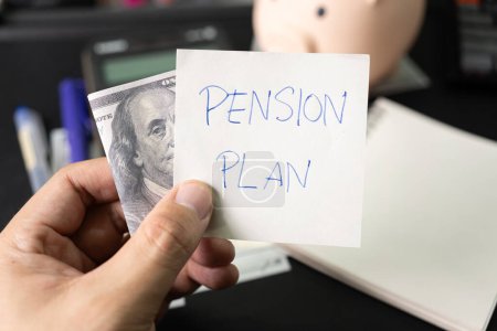 Photo for Paper note with text PENSION PLAN with stationery and dollar on desk. Pension Plan. Retirement concept. Pension calculation concept. - Royalty Free Image