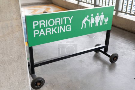 Photo for Green sign with Priority parking for vehicles of people with disabilities. - Royalty Free Image