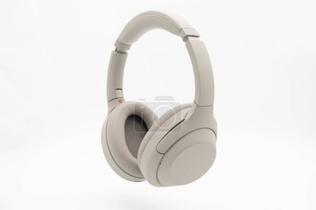 Wireless Silver headphones background on isolated background. With Noise Cancelling and Integrated Microphone.