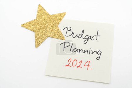 Budget Planning 2024 text message by hand writing with golden star. Budget planning concept.