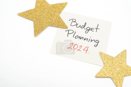 Budget Planning 2024 text message by hand writing with golden star. Budget planning concept.