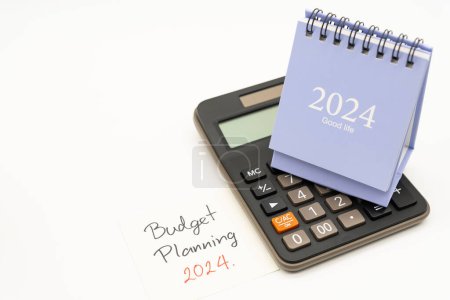 Budget Planning 2024 text message by hand writing on paper note and Calendar 2024. Budget planning concept. isolated on white background.