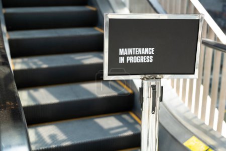 Maintenance in progress sign. Maintenance of escalators.