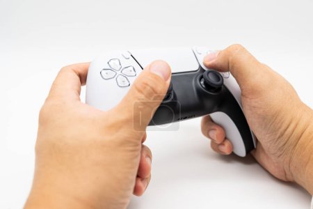 Console gamepad new generation on male hand in isolated background. Controller console playing player holding hobby playful enjoyment.