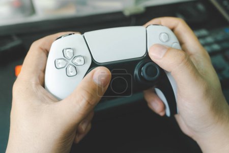 Console gamepad new generation on male hand background. Controller console playing player holding hobby playful enjoyment.