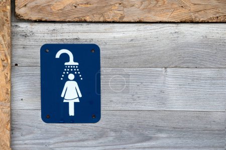 Photo for Informative sign on the board wall in the shower - Royalty Free Image
