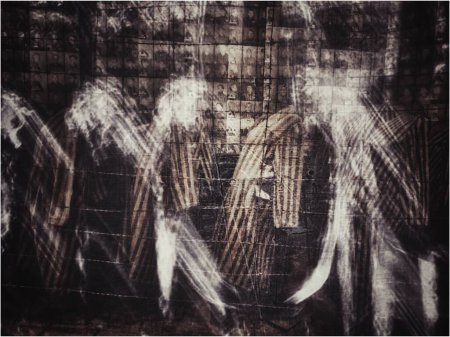 Ghosts of tortured prisoners of the Auschwitz concentration camp. Silhouettes of old men, women, and children were tortured and murdered in the concentration camp.