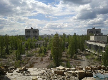A haunting image of the city of Pripyat, frozen in time 37 years after the Chornobyl nuclear power plant disaster. The desolate streets, reclaimed by nature, whisper the solemn tale of a once vibrant community now shrouded in silence. 