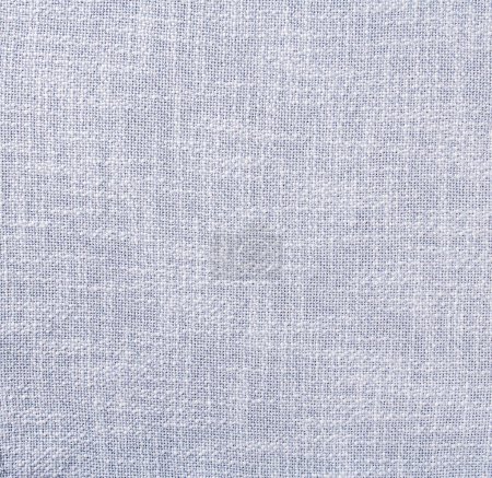 Foto de Primer plano detallado de un fondo textil hecho de tela de lino gris-azul de alta calidad, adecuado para su uso como elemento de diseño, telón de fondo o textura en varios proyectos creativos y presentaciones.. - Imagen libre de derechos