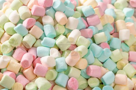 A close-up shot of a delightful assortment of colorful marshmallows, perfect for adding a touch of sweetness to your designs and enhancing confectionery-themed projects or promotions.