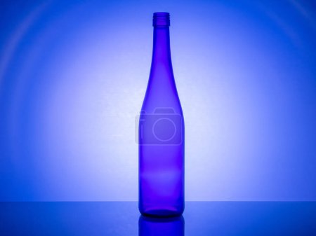 A close-up shot of elegant glassware, with creative lighting using colored gel filters to create a stunning and artistic backlight effect. This unique image is perfect for design and art concepts.