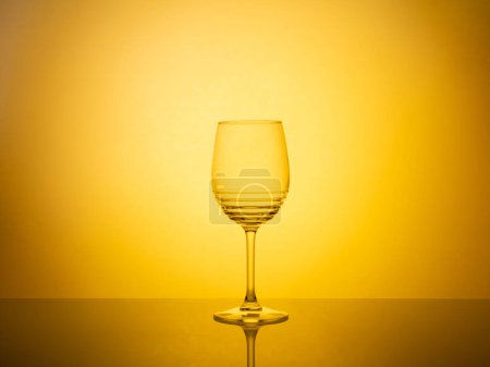 A creative composition of glassware photography featuring colorful gel filters and backlighting, resulting in a vibrant and visually captivating image.