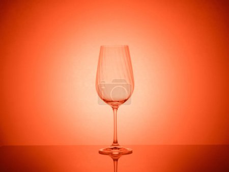 A stunning presentation of glassware with vibrant gel filters and creative lighting, resulting in a mesmerizing and artistic photographic display with an array of colors and reflections.