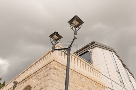 Photo for Safed, Israel, April 29, 2023 : Decorative metal street lamp in the old part of Safed city in northern Israel - Royalty Free Image