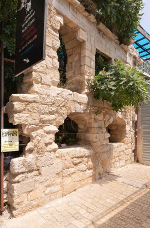 Photo for Safed, Israel, July 01, 2023 : Ruins of an old stone building on a quiet street in the old part of Safed city in northern Israel - Royalty Free Image
