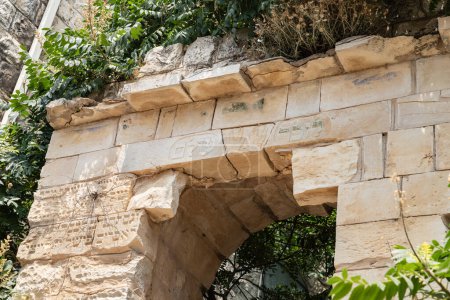 Photo for The ruins of an old stone building with Hebrew words carved in stone on a quiet street in the old part of Safed city in northern Israel - Royalty Free Image
