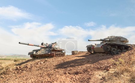 Photo for Syrian and Israeli tanks destroyed during the Yom Kippur War are in the Valley of Tears at the OZ 77 Tank Brigade Memorial on the Golan Heights in northern Israel - Royalty Free Image